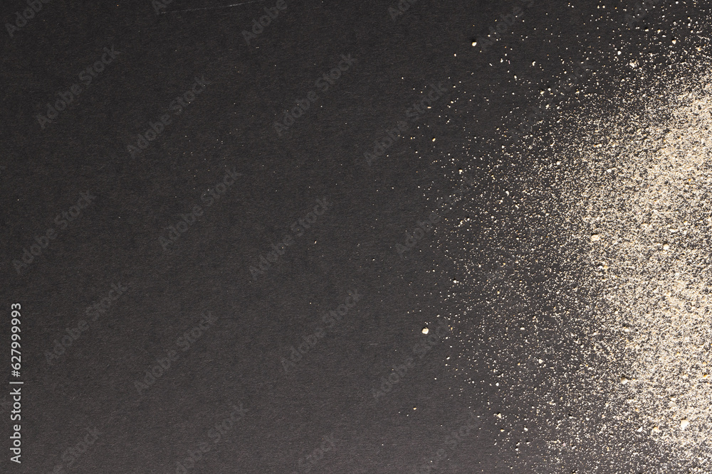 Fototapeta premium Close up of sand and copy space on black background