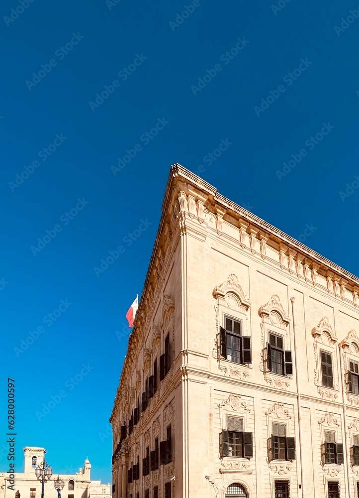 Fototapeta premium Corner of magnificent baroque palazzo the Auberge de Castille located at Castile Place in Valletta, Malta