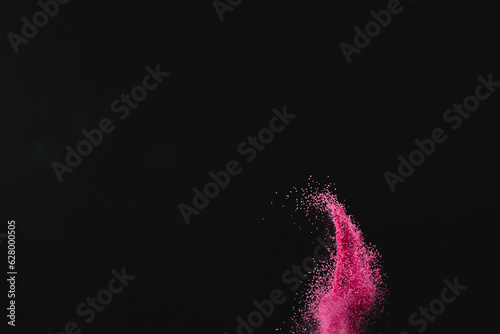 Wallpaper Mural Close up of pink sand thrown in the air and copy space on black background Torontodigital.ca