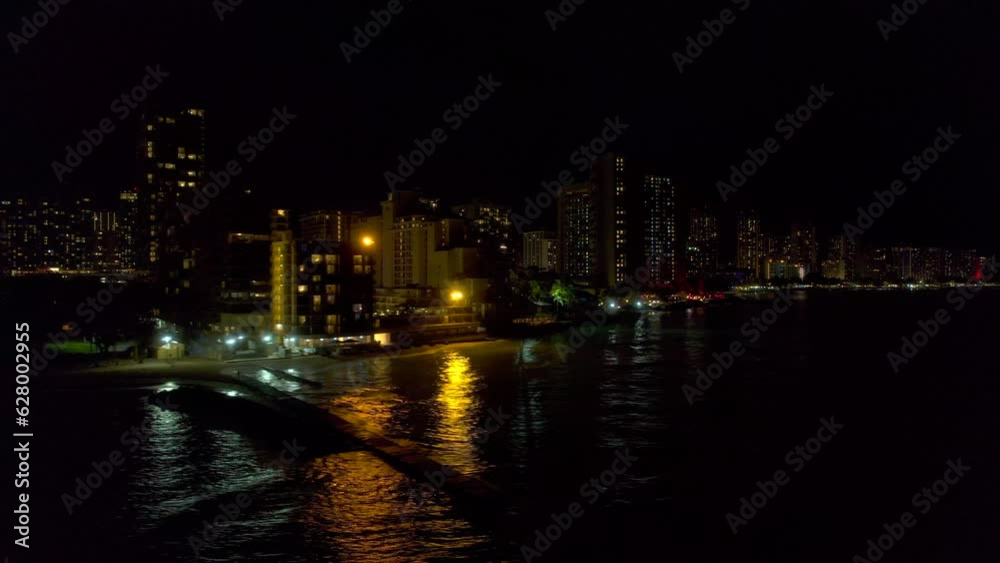 South to Southeast coastline of Honolulu Hawaii cityscape reveal of aerial view from left to right at night. 4k drone. South to Southeast coastline of Honolulu Hawaii cityscape reveal of aerial view from left to right at night. 4k drone.