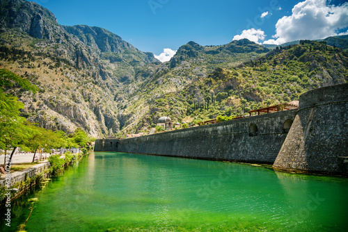 View of northern walls of Old Town of Kotor and Skurda river photo