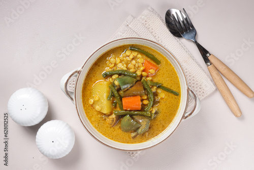 Dalca Sayur or Vegetables Dalca is a Stewed Vegetables Curry with Lentils, Famously Served with Briyani or Tomato Rice. photo