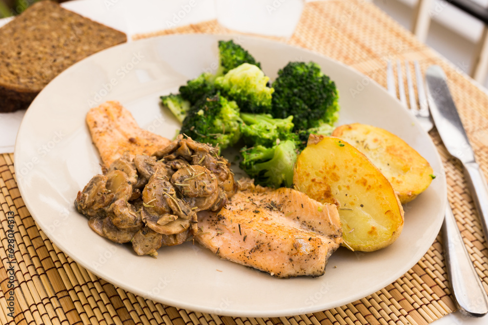 Fried fillet of river trout with a complex side dish Fried fillet of river trout with a complex side dish
