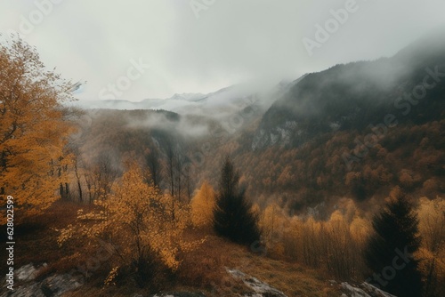 A fall scene with golden leaves, foggy mountains, and overcast sky. Generative AI
