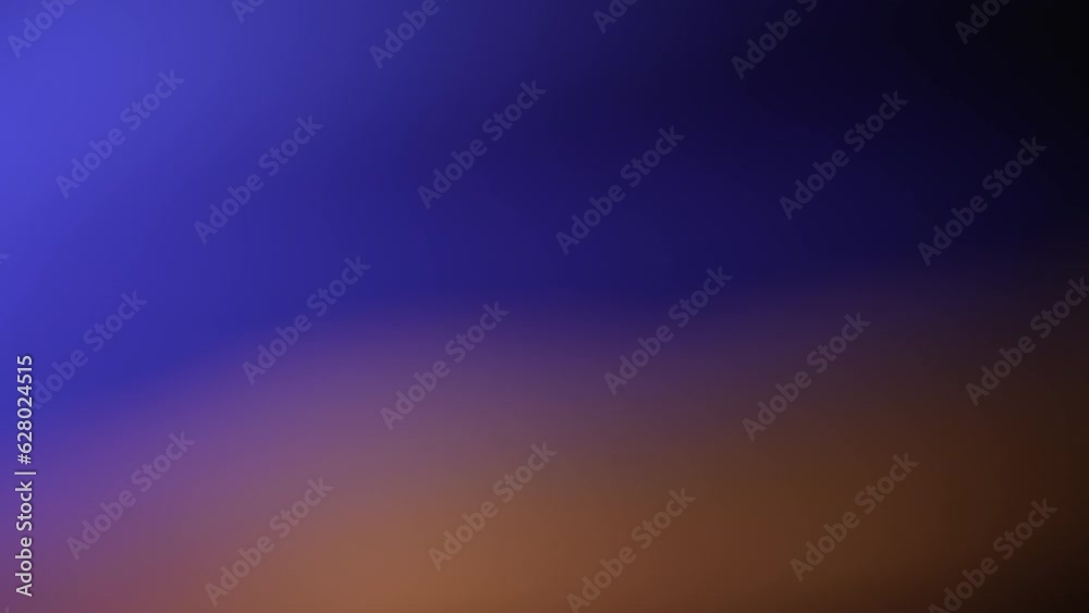The video footage captures attention with its magical background filled with blurred light stripes orange and blue, which create a special atmosphere and harmony. Blurred light fluxes abstract effect