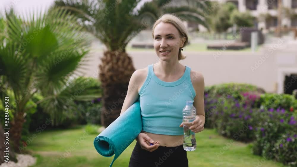 A slender young woman in an expensive resort. Blonde goes to yoga or fitness class. A slender young woman in an expensive resort. Blonde goes to yoga or fitness class.