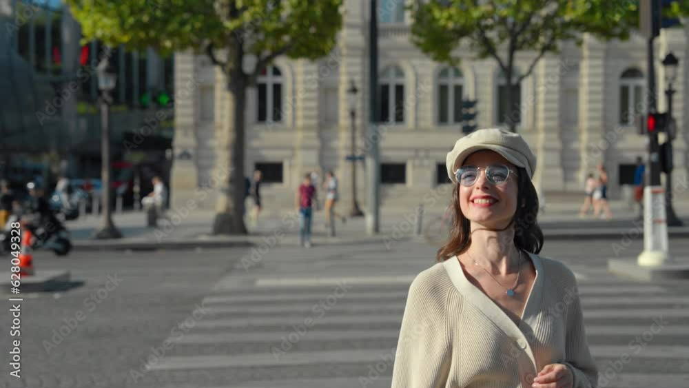 Beautiful girl crossing the road on the Champs Elysees in Paris Beautiful girl crossing the road on the Champs Elysees in Paris