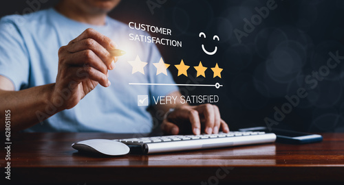 Man Gives 5-Star Rating on Computer, Exuding Customer Satisfaction