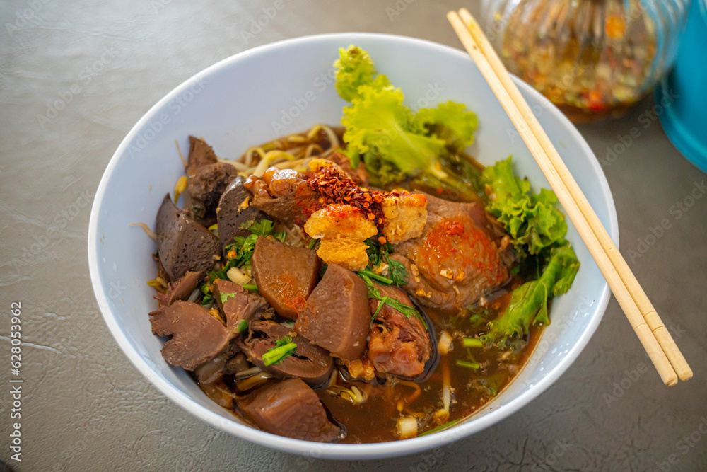 Duck Noodles soup - Braised of duck noodles in white bowl of wood table at close up view, Asian food Duck Noodles soup - Braised of duck noodles in white bowl of wood table at close up view, Asian food