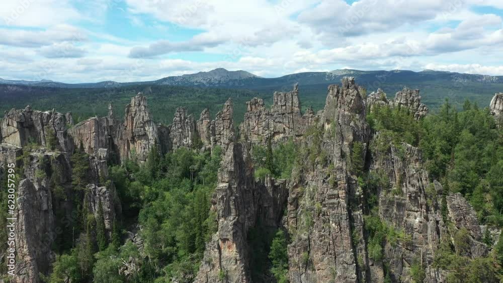 Scenery aerial view of Inzerskie Zubchatki mountains. Inzerkiye mountain range in Tirlyan village, Bashkortostan. Famous stone pylons in Ural mountains Scenery aerial view of Inzerskie Zubchatki mountains. Inzerkiye mountain range in Tirlyan village, Bashkortostan. Famous stone pylons in Ural mountains