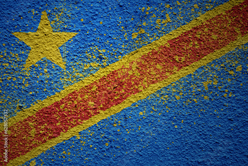 painted big national flag of democratic republic of the congo on a massive old cracked wall