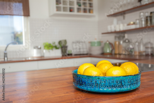 lemons in bowl on the kitchen countertop