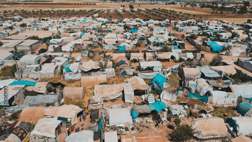 Aerial view of hundreds of tents inhabited by Syrian refugees for years due to the war that destroyed their homes. photo