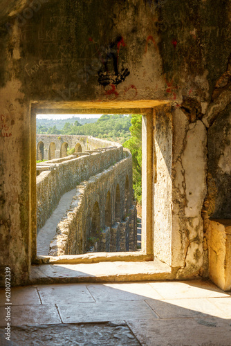 the aqueduct was built by Filipe Terzio, and completed by Pedro Fernando de Torres in 1614 the aqueduct supplied the convent of christ in Tomar portugal with its water. 
 photo