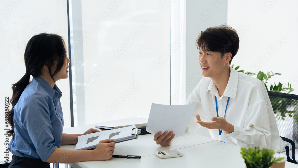 employee discuss business income report together in the office employee discuss business income report together in the office