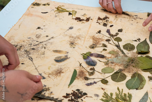 Obraz na płótnie Eco-printing is a technique where plants, leaves and flowers leave their shapes, color, and marks on fabric w salonie