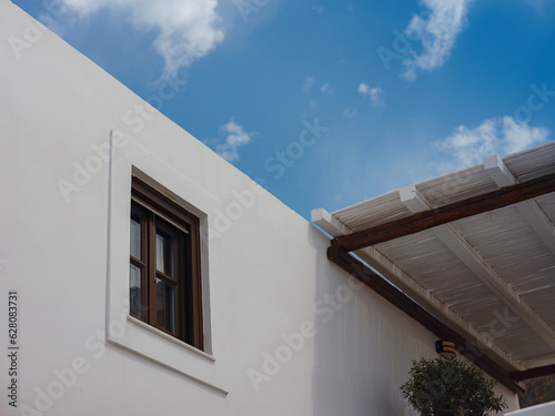 travel to city of Lindos on island of Rhodes, Greece. Details of streets of old town Lindos. Interesting elements of door, shutters, bas-relief of walls. tourist attraction on island of Rhodes