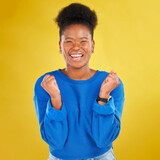 Excited, celebration and portrait of black woman in studio happy with news, deal and announcement on yellow background. Smile, face and African female winner celebrating lottery, bonus or promotion