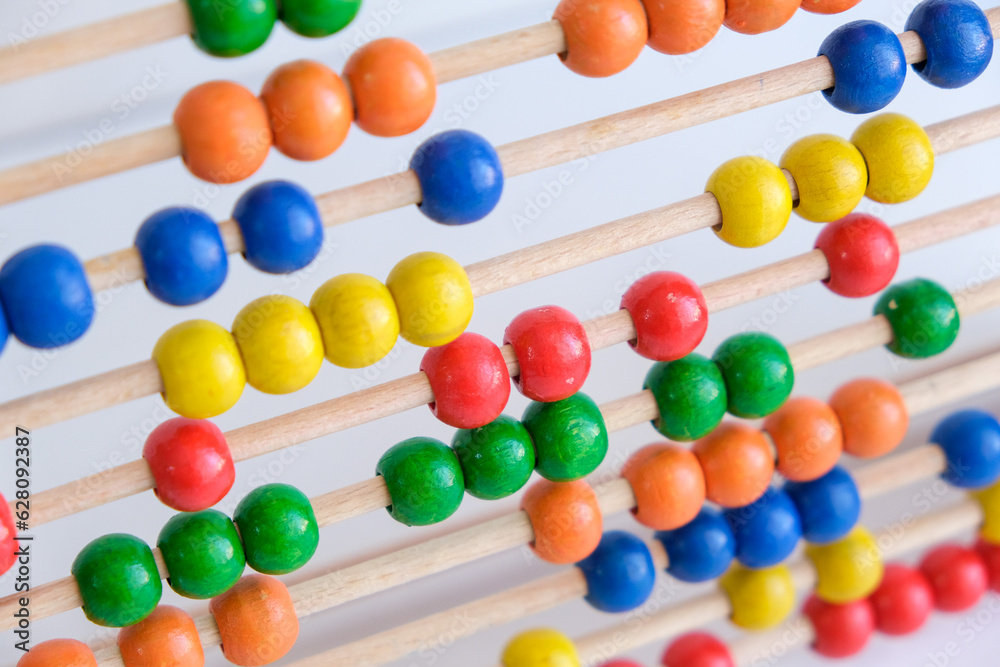 Close up colorful school abacus bead background for kids. Education school mathematics wallpaper. Kids learning count, children math class concept. 