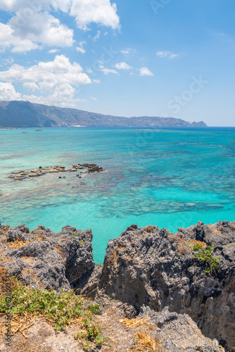 View of the rocks and crystal clear water of The Mediterranean Sea on the background  Elafonissi  Kissamos  Crete  Greece