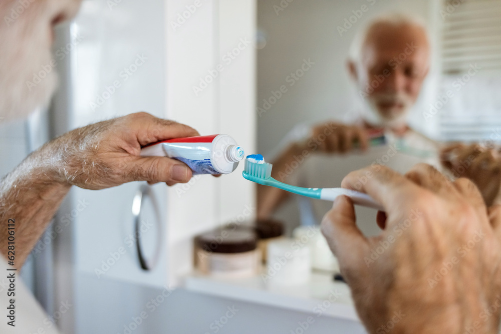 Cleaning, mouth or hand brushing teeth with dental toothpaste for healthy oral hygiene grooming. Eco friendly, senior man with a natural toothbrush for teeth whitening. Cleaning, mouth or hand brushing teeth with dental toothpaste for healthy oral hygiene grooming. Eco friendly, senior man with a natural toothbrush for teeth whitening.