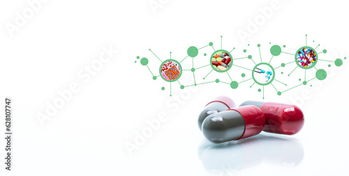Red and gray antibiotic capsule pills. Antibiotic drugs. Pharmaceutical industry. Health and medical care concept. Antibiotic drug pharmacology. Drug research and development. Prescription medicine.