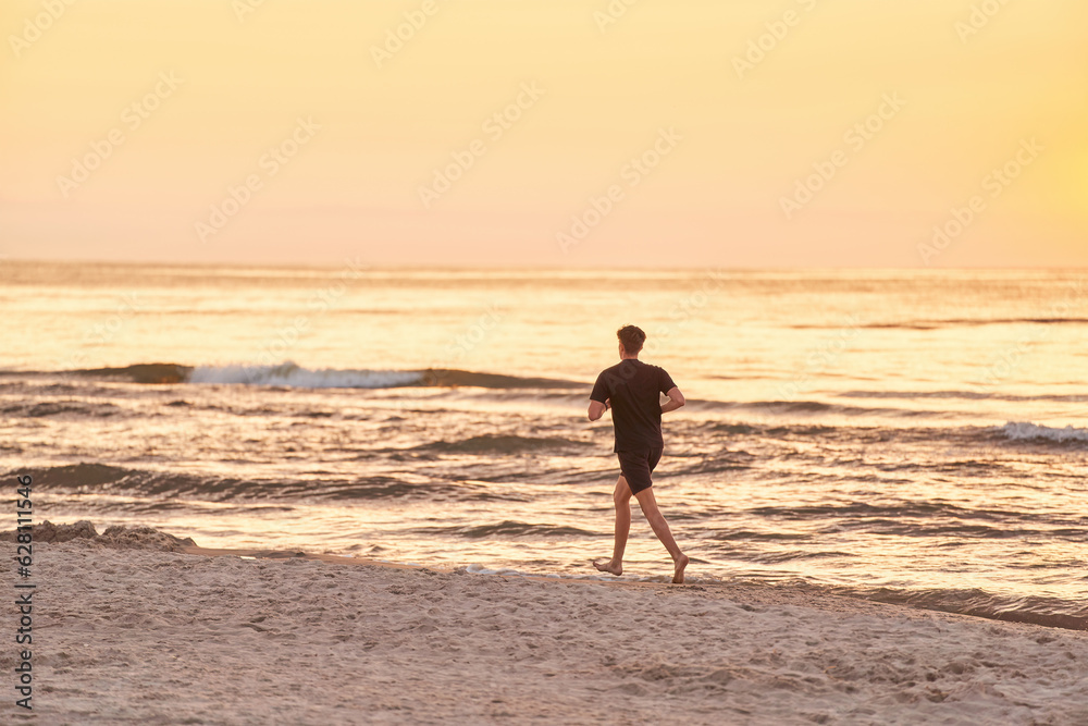 Endless Stride. Young Man's Sunset Run Along the Ocean Beach. Running on the sea beach. Endless Stride. Young Man's Sunset Run Along the Ocean Beach. Running on the sea beach.