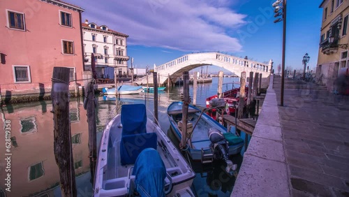Timelapse of the bridge on the canal with boats