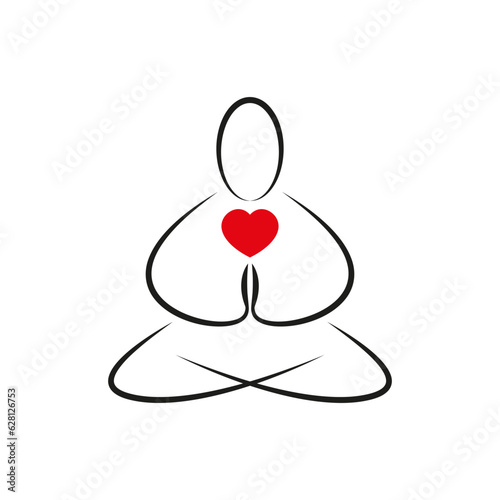 Meditation and a man with a heart. A man meditates sitting in the lotus position with his legs crossed.