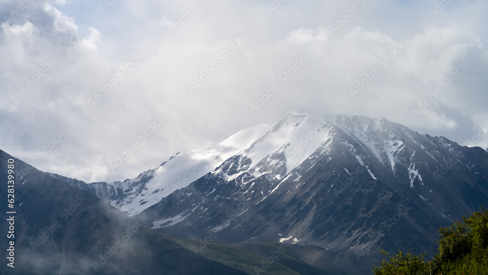 cloudy weather in a mountain gorge. clouds over mountain peaks cloudy weather in a mountain gorge. clouds over mountain peaks