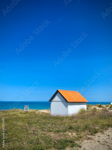 Orange beach hut on the coast