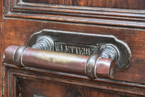 Door handle with flap for mail in Italy with writing Lettere on it