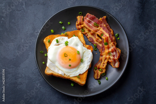 Fried eggs with bacon. Baco...