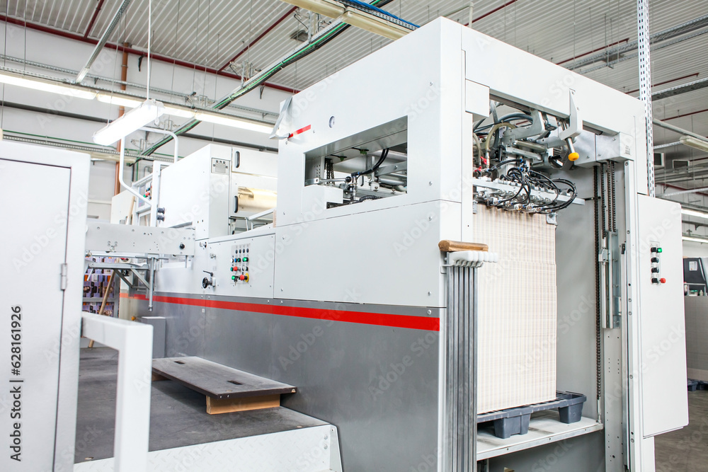 The equipment for a press. Offset machine at the printing manufacturing. Printing machine The equipment for a press. Offset machine at the printing manufacturing. Printing machine