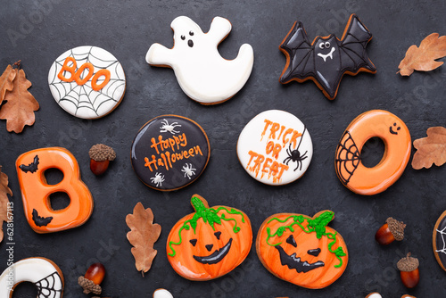 Happy Halloween. Trick OR Treat. Gingerbread cookies on dark stone background. Sweets for Halloween party