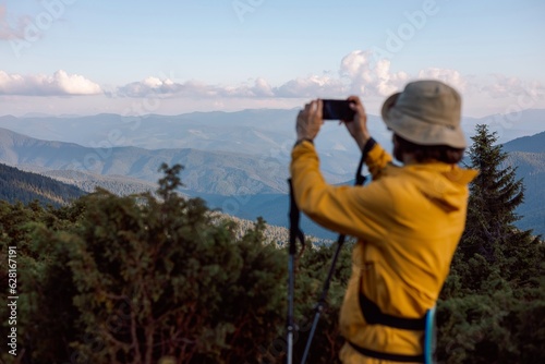 blurred silhouette of a traveler on the background of evening mountain landscapes