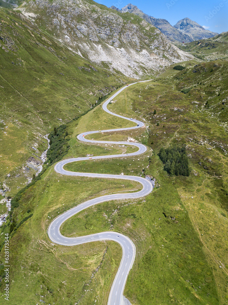 Aerial view of the winding road over the Julier Pass in Swiss Alps mountain in summer, Canton Grison, Switzerland