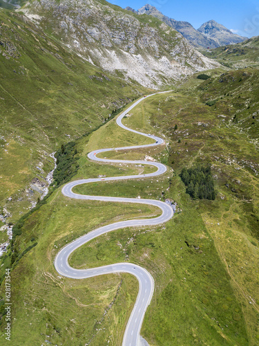 Aerial view of the winding road over the  Julier Pass in Swiss Alps mountain in summer, Canton Grison, Switzerland photo