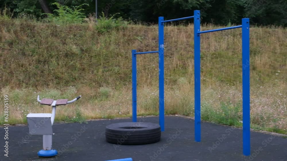portrait of a young man doing pull-ups on the horizontal bar outdoors on a street playground, a strong athlete, a healthy man, a horizontal bar on the street. sports guy, Street Workout
portrait of a young man doing pull-ups on the horizontal bar outdoors on a street playground, a strong athlete, a healthy man, a horizontal bar on the street. sports guy, Street Workout