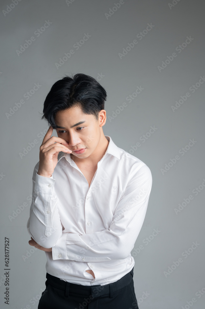 young Asian businessman in white shirt isolated on green background young Asian businessman in white shirt isolated on green background