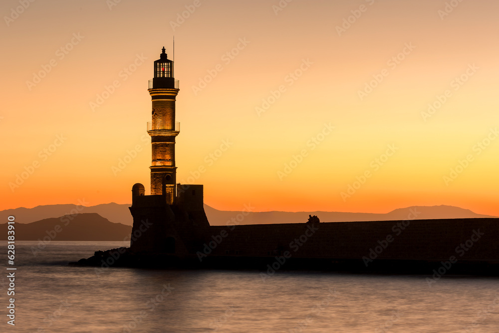 Old Venetian lighthouse with a colorful sunset