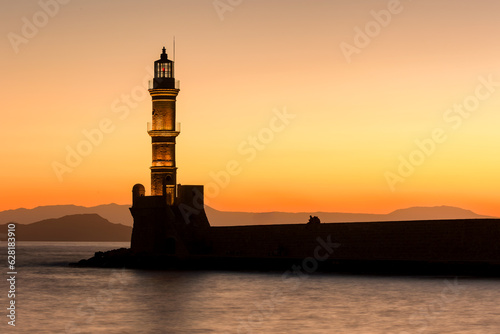 Old Venetian lighthouse with a colorful sunset