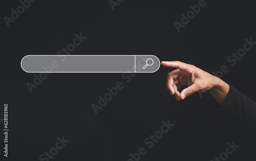Finger touches the button of a blank search bar on a business web banner promoting the concept of search engine optimization black background. digital screen importance of SEO in the world technology
