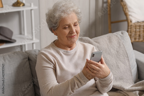 Senior woman with mobile ph...
