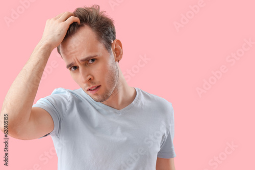 Upset young man with hair l...