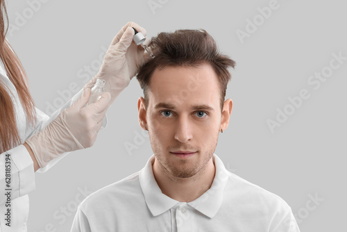 Young man and doctor with s...