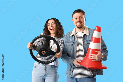 Young couple with steering ...