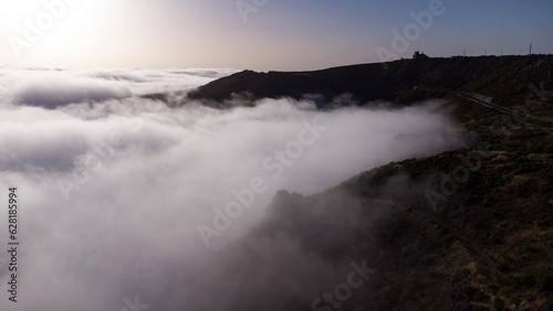 Aerial drone view over the foggy mist on the mountain tops of Madeira