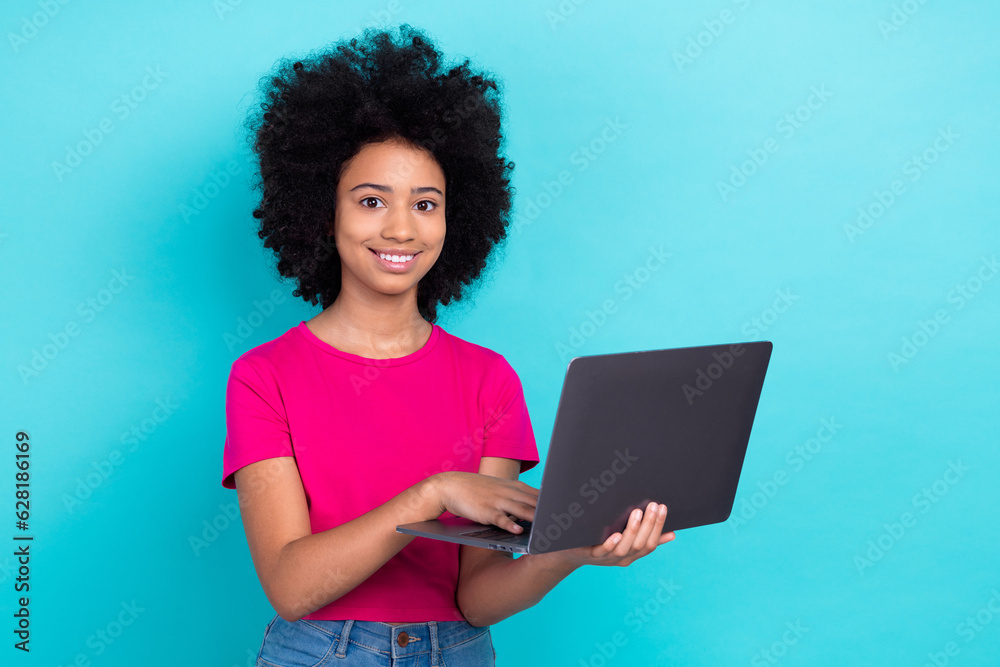 © deagreez - Photo of pretty positive small lady wear pink t-shirt typing apple samsung modern gadget empty space isolated turquoise color background © deagreez - Photo of pretty positive small lady wear pink t-shirt typing apple samsung modern gadget empty space isolated turquoise color background