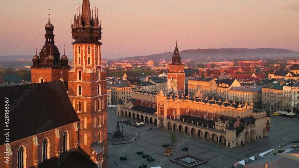 krakow city old town aerial view seen from inside the room,drone flying out the window at sunrise,sunny day poland